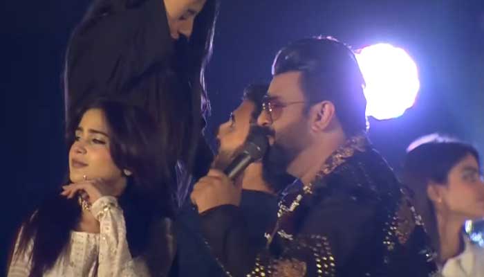 Aima Baig (left) and Sahir Ali Bagga (right) perform during the opening ceremony of the PSL 8 in Multan on February 13, 2023, in this still taken from a video. — YouTube/GeoNews