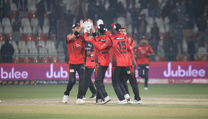 Lahore Qalandars celebrating after their bowler takes a wicket during a PSL match against Multan Sultans in Multan on February 13, 2023. — PSL