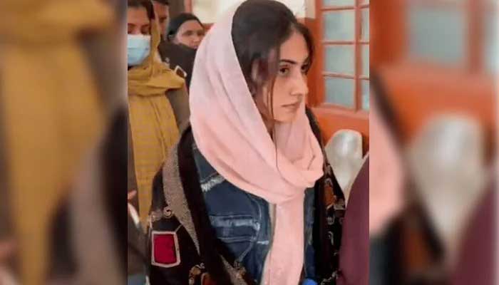 Dania Shah being escorted to a courtroom in this undated photo. — YouTube screengrab/Geo News