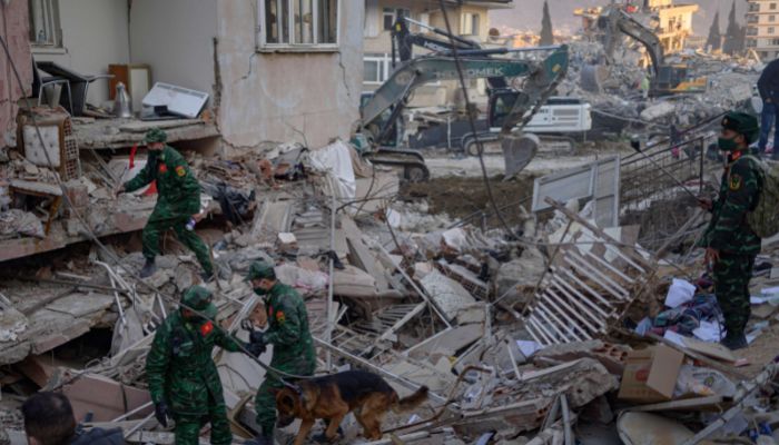 A Chinese search and rescue crew operate in the rubble of collapsed buildings in Hatay, on February 14, 2023.— AFP