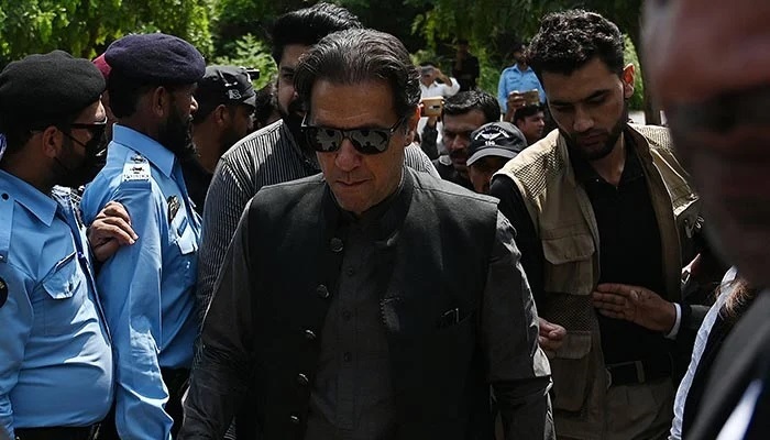 Former Pakistani prime minister Imran Khan (centre) arrives to appear before a court in Islamabad on September 1, 2022. — AFP/File
