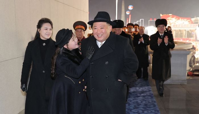 This picture taken on February 8, 2023 and released from North Korea´s official Korean Central News Agency (KCNA) on February 9, 2023 shows North Korea´s leader Kim Jong Un (R), his daughter presumed to be named Ju Ae (C) and wife Ri Sol Ju (L) attending a military parade celebrating the 75th anniversary of the founding of the Korean People´s Army in Kim Il Sung Square in Pyongyang.— AFP