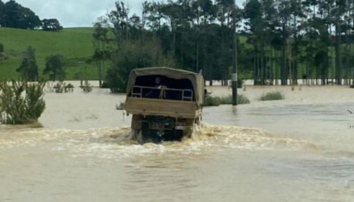 A New Zealand Defence Force truck driving through floodwaters near Dargaville on the North Island.— AFP/file