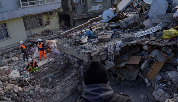 Greek and Turkish rescuers are at work to extract bodies of victims from the rubble of a collapsed building in Antakya, south of Hatay, on February 15, 2023, nine days after a 7,8-magnitude struck the country’s southeast. — AFP