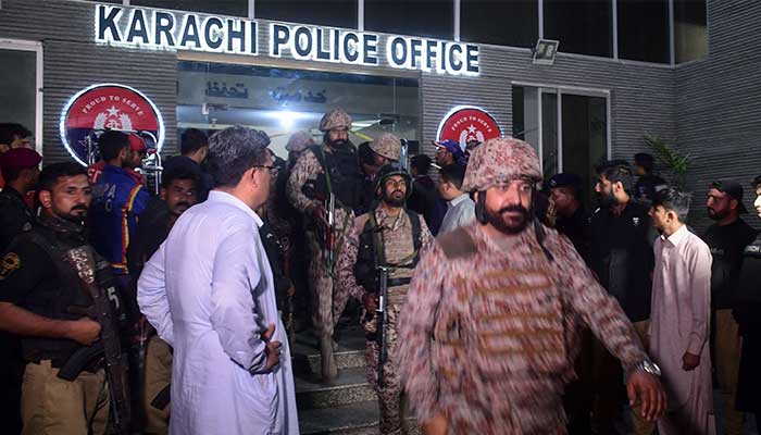 Paramilitary soldiers leave a police compound after taking control of the building following an attack by Pakistani Taliban fighters in Karachi on February 17, 2023. — AFP