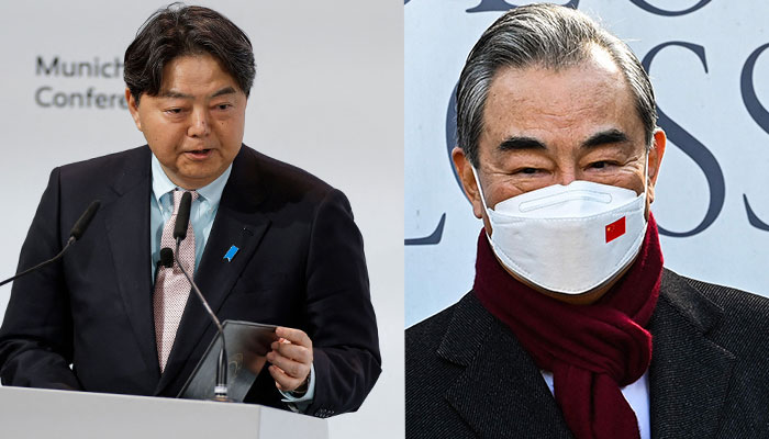 Japanese Foreign Minister Yoshimasa Hayashi delivers a speech at the Munich Security Conference (MSC) (L), and Chinese Foreign Minister Wang Yi (R).— AFP/file