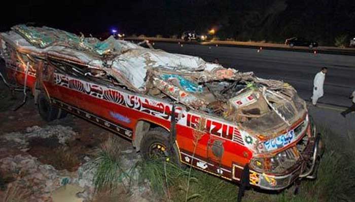 A representational image of a bus that turned turtle after a road accident near Kallar Kahar. — Twitter