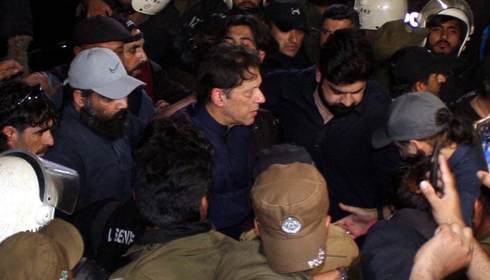 Pakistan Tehreek-e-Insaf (PTI) Chairman Imran Khan arrives at the Lahore High Court amid tight security on February 20. — PPI
