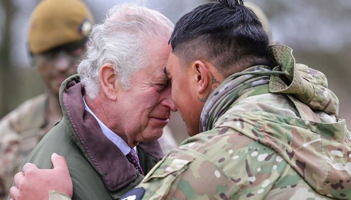 King Charles takes part in a traditional Maori greeting