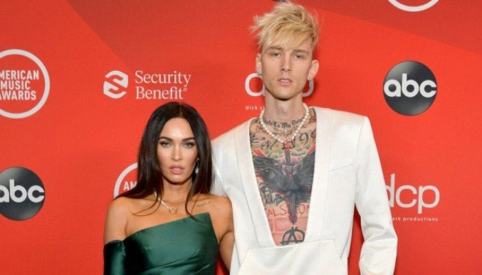 Machine Gun Kelly, Megan Fox haven't 'split' but they're 'barely hanging on'