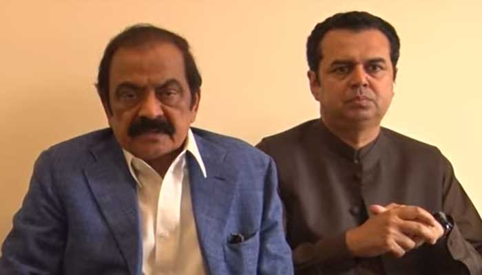 Interior Minister Rana Sanaullah addresses a press conference, flanked by PML-N leader Talal Chaudhry, in Sahiwal on February 28, 2023, in this still taken from a video. — YouTube/Hum News Live
