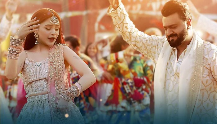 Pakistani singers Aima Baig (Left) and Sahir Ali Bagga dance on the beats of theri new song Washmallay in this still image taken during the shoot of the music video. — Instagram/@aima_baig_official