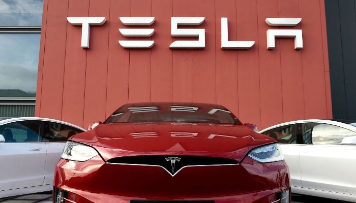 The logo marks the showroom and service center for the US automotive and energy company Tesla in Amsterdam on October 23, 2019.— AFP