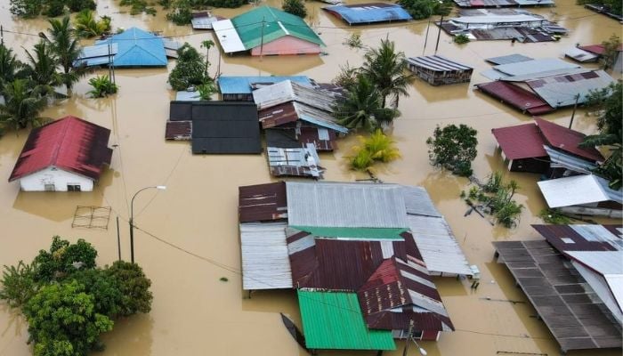 An aerial photo shows flooded houses in Yong Peng, Malaysia, on March 04 2023.— AFP