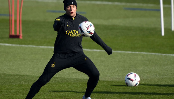 Paris Saint-Germains French forward Kylian Mbappe controls the ball during a training session at clubs training ground in Saint-Germain-en-Laye, west of Paris on March 3, 2023, on the eve of the L1 football match against Nantes. AFP