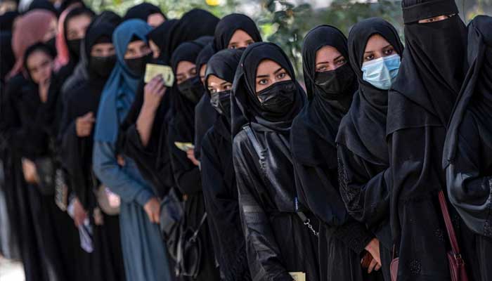 Afghan female students queue for entrance exams at Kabul University on 13 October 2022. — AFP/File