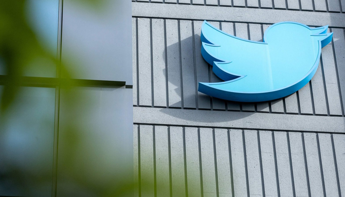 The Twitter logo is seen on a sign on the exterior of Twitter headquarters in San Francisco, California, US, October 28, 2022. — AFP