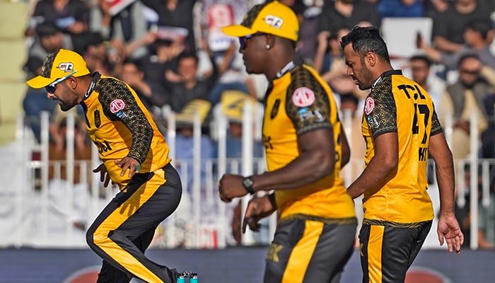 Peshawar Zalmi players celebrate after taking a wicket of Lahore Qalandars during a match at the Pindi Cricket Stadium on March 7, 2023. — PSL