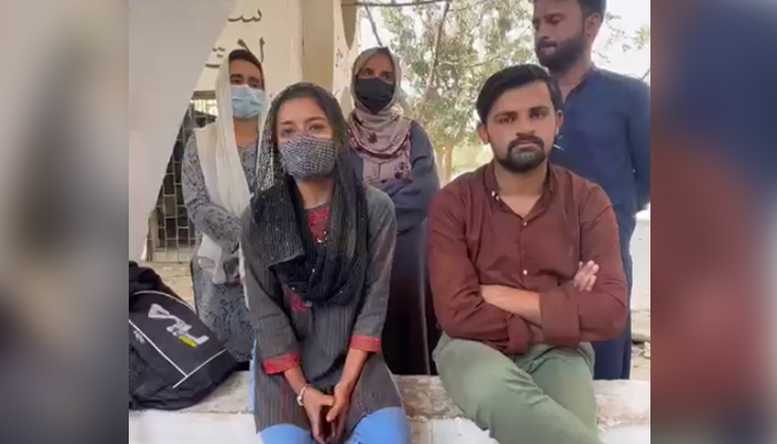 Students of Karachi University who alleged they were beaten for celebrating Holi speak in a video statement, on March 7, 2023, in this still taken from a video. — Geo News
