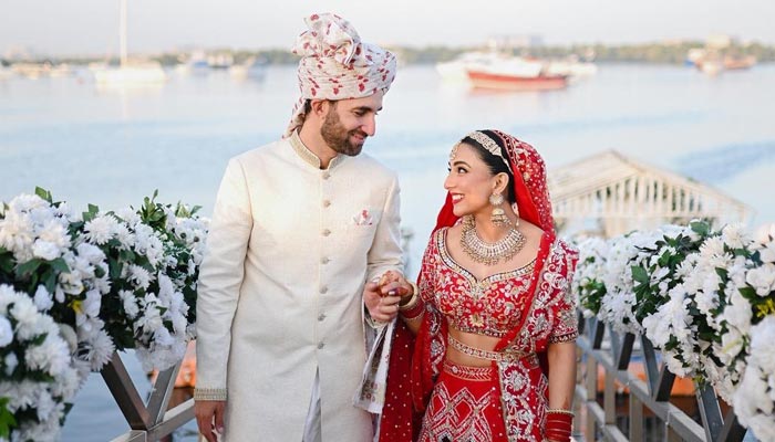 Pakistani actor Ushna Shah poses with her husband, Hamza Amin, during her wedding ceremony held on February 26, 2023. — Instagram/@ushnashah