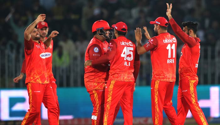 Islamabad United players celebrate during the 24th match of the eighth season of Pakistan Super League (PSL) at the Pindi Cricket Stadium in Rawalpindi on March 7, 2023. — PSL