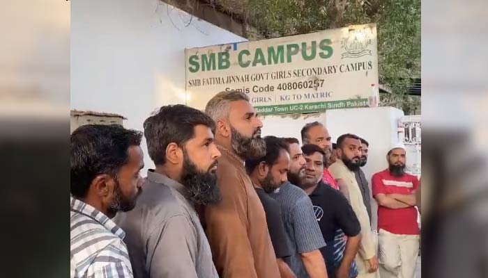 People queue outside SMB Fatima Jinnah Government Girls School in Karachis Garden area in District West for admission forms in this still taken from a video on March 7, 2023. — Twitter/@ZindagiTrust