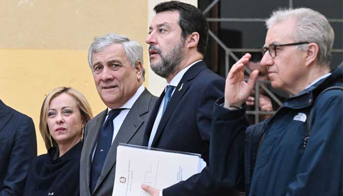 (From L) Italys Prime Minister Giorgia Meloni and ministers arrive on March 9, 2023 for the weekly Cabinet meeting at the town hall of Cutro, Calabria region. — AFP