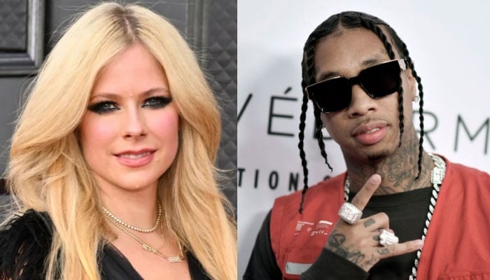 Avril Lavigne and Tyga seen holding hands with matching bomber jackets on dinner date