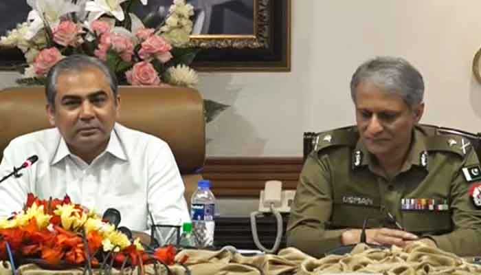 Punjab caretaker Chief Minister Mohsin Naqvi (left) addressing a press conference alongside Inspector-General Punjab Usman Anwar in Lahore on March 11, 2023, in this still taken from a video. — YouTube/GeoNews