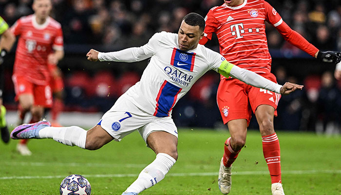 TOPSHOT - Paris Saint-Germain´s French forward Kylian Mbappe (L) and Bayern Munich´s German midfielder Jamal Musiala vie for the ball during the UEFA Champions League round of 16, 2nd-leg football match FC Bayern Munich v Paris Saint-Germain FC in Munich, southern Germany, on March 8, 2023.—AFP