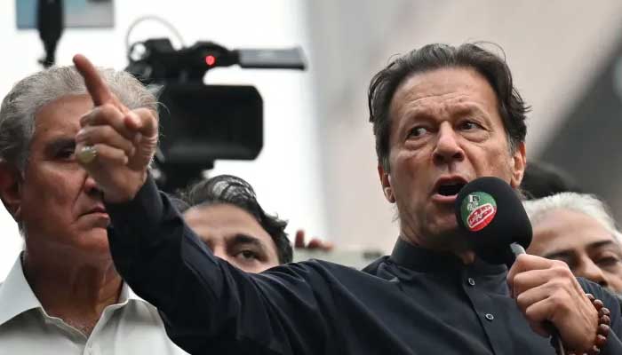 PTI chief Imran Khan addresses his supporters during an anti-government march towards capital Islamabad, demanding early elections, in Gujranwala on November 1, 2022. — AFP