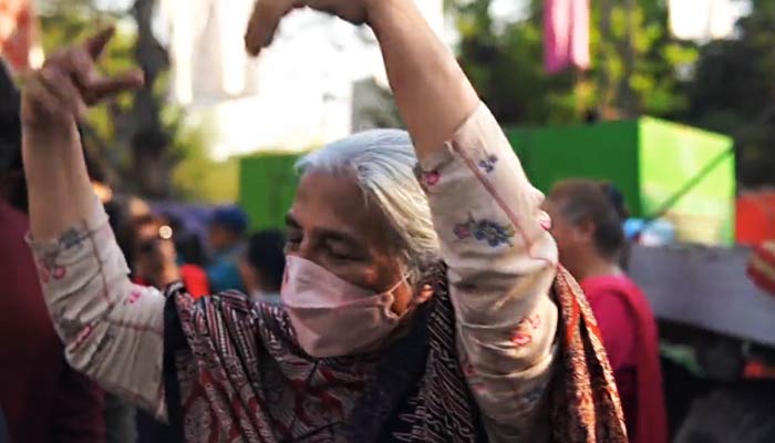An elderly woman dances to Peechay Hutt during Aurat March. — Twitter/@AuratMarch