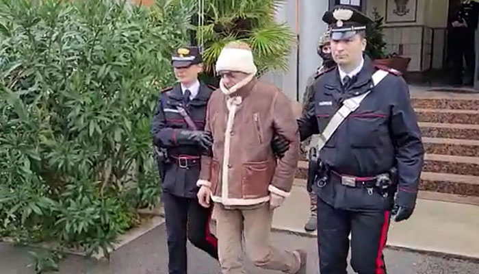 Cosa Nostra boss Matteo Messina Denaro is led away by police after being arrested earlier this year. AFP