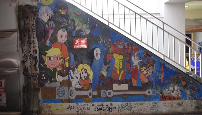 An art wall displaying years of animation and beloved characters