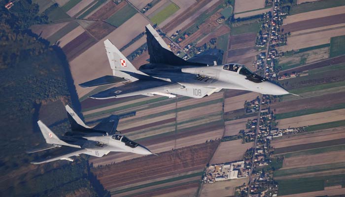 Two MiG 29 fighter jets take part in the NATO Air Shielding exercise near the air base in Lask, central Poland, Oct. 12, 2022. —AFP/File