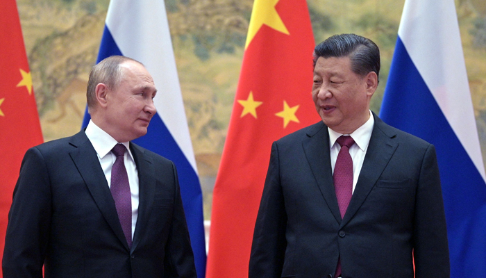 Russian President Vladimir Putin (L) and Chinese President Xi Jinping pose for a photograph during their meeting in Beijing. — AFP/File