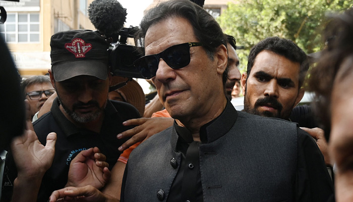 Former prime minister Imran Khan (centre) arrives at the Islamabad High Court, on September 22, 2022. — AFP