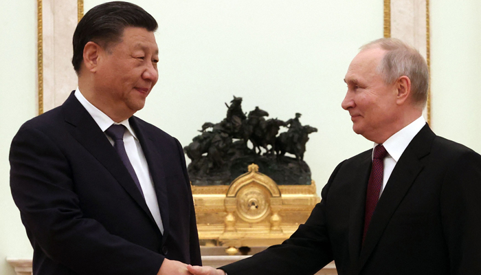 Russian President Vladimir Putin meets with Chinas President Xi Jinping at the Kremlin in Moscow on March 20, 2023. — AFP