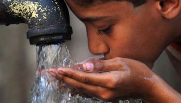 A child drinks water. — AFP/File