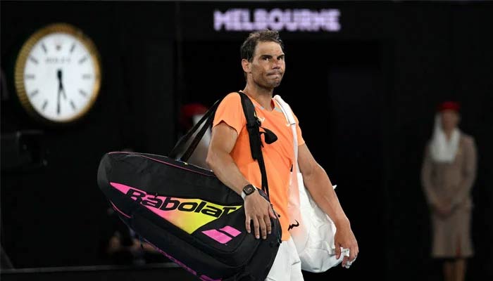 Spains Rafael Nadal leaves after defeat against Mackenzie McDonald of the US in the mans singles on day three of the Australian Open tennis tournament in Melbourne on January 18, 2023. — AFP