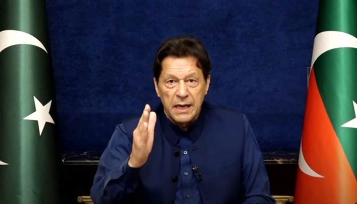 PTI Chairman Imran Khan addresses workers and supporters via video link from Lahore, on March 22, 2023, in this still taken from a video. — YouTube/PTI