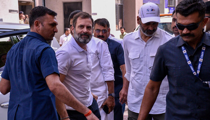 Indias Congress party leader Rahul Gandhi (2L) arrives at the district court in Surat on March 23, 2023. — AFP