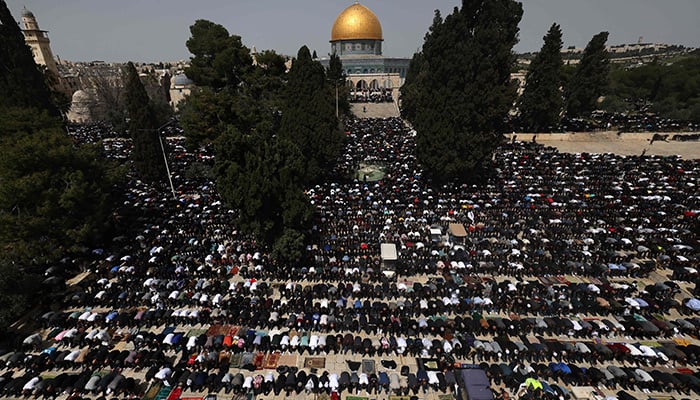 People perform the first Friday prayer of the Islamic fasting month of Ramadan, at the Al-Aqsa mosque in Jerusalem, on March 24, 2023. — AFP