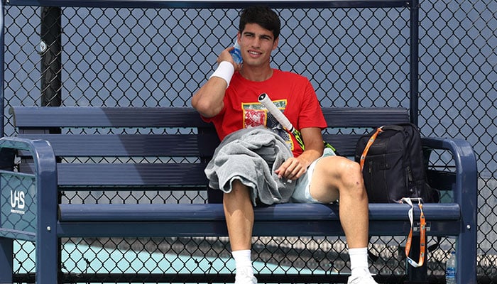 Carlos Alcaraz of Spain takes a break during a practice session prior to his first match at Hard Rock Stadium on March 24, 2023 in Miami Gardens, Florida.
