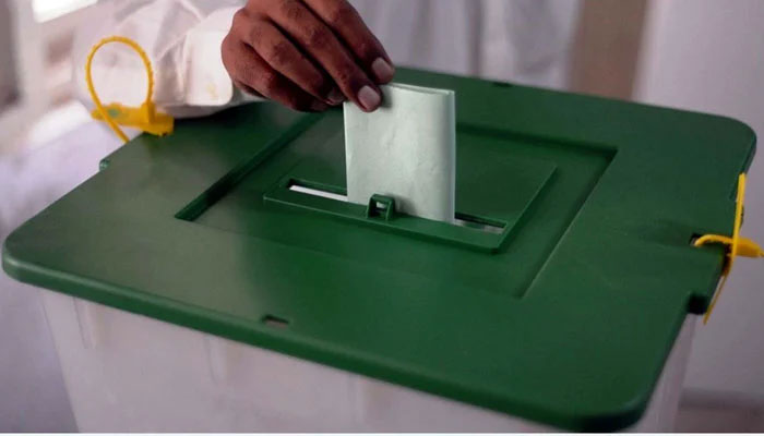 A voter is casting his vote at a polling station during by-elections in the NA-237 constituency in Karachi on October 16, 2022. — PPI
