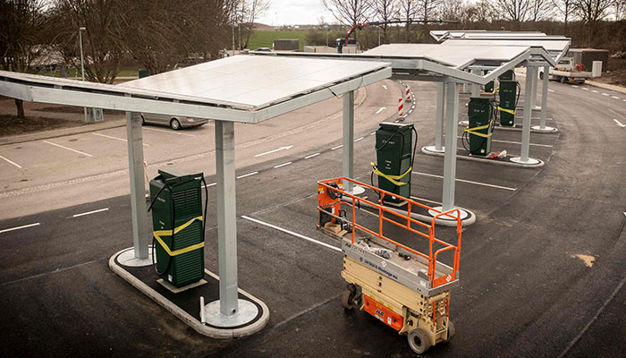 This aerial view shows a soon-to-open Charging Park for electric cars at the Lillebaelt Syd rest area on the highway near Middelfart, Denmark, on March 27, 2023. The Danish Directorate of Roads (Denmark Vejdirektoratet) is in the process of installing the first 600 charging points along the Danish highways.—AFP