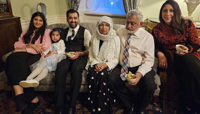 Newly appointed First Minister of Scotland Humza Yousaf (third left) poses for a picture with family at Bute House on March 28, 2023. — Twitter/@HumzaYousaf