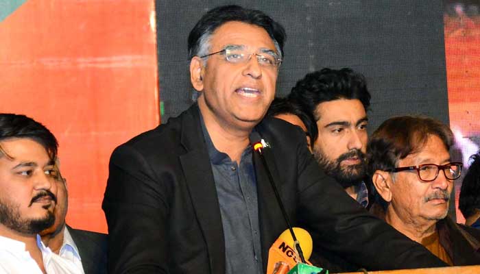 PTI leader Asad Umar addressing party workers during election campaign in Hyderabads Latifabad area on January 13, 2023. — INP