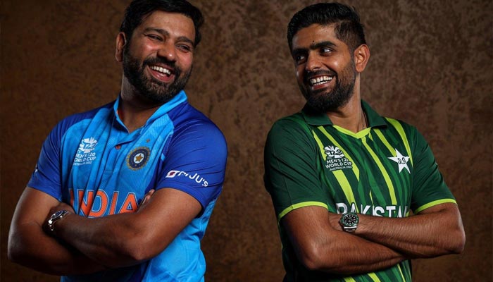 Pakistan skipper Babar Azam (R) poses for a picture with his Indian counterpart Rohit Sharma during a photoshoot of the ICC Mens T20 World Cup. — Twitter/ICC