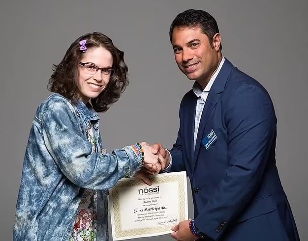 Image shows Audrey Hale receiving a certificate from her college.— Nossi College of Art and Design
